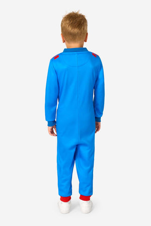 Child wearing a blue onesie with red accents on a white background. View from the back