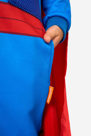 Close-up of a superhero onesie with a visible OppoSuits logo on a white background