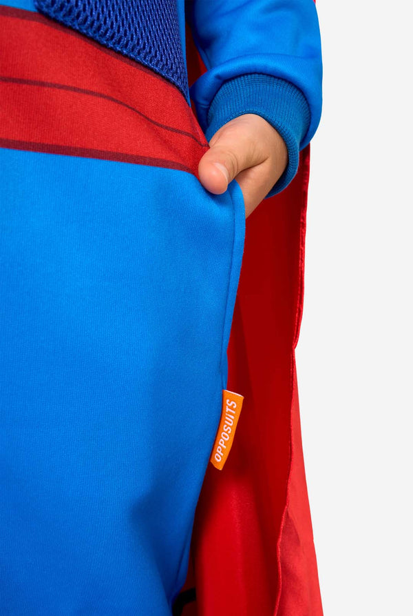 Close-up of a superhero onesie with a visible OppoSuits logo on a white background