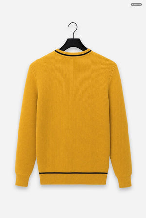 A mustard yellow ribbed knit sweater with black trim at the crew neck and hem, hanging on a black hanger against a light gray background.