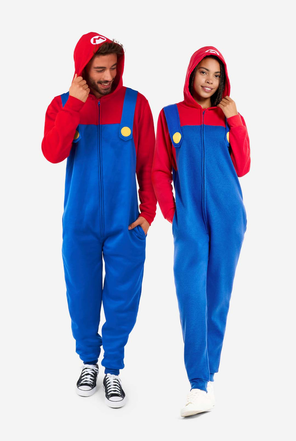 Man and Woman wearing red and blue, Unisex Adult Onesie with Super Mario theme. Onesie resembles the 
 Super mario outfit.