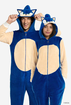 Two people wearing blue and beige onesies with Sonic designs on a white background.
