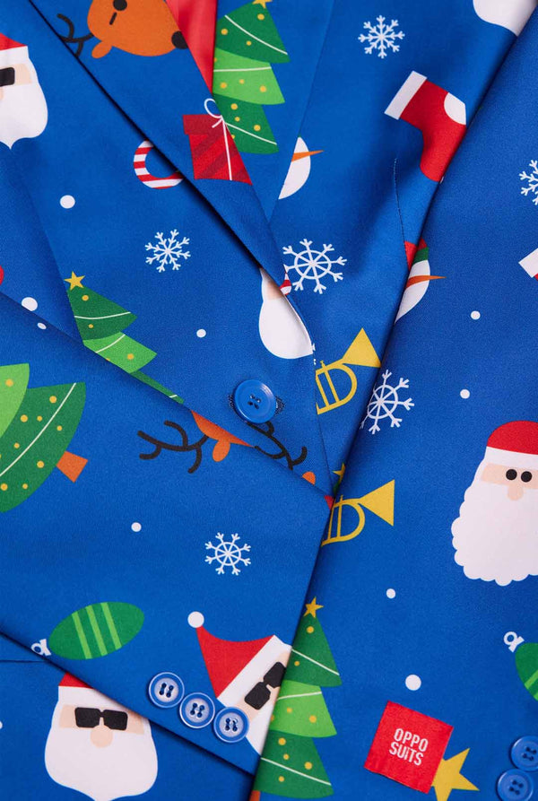 Woman wearing blue Christmas blazer for women, with Christmas icons on it. Close up.