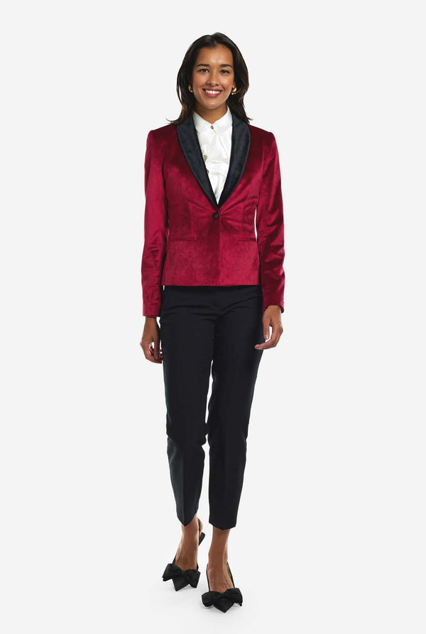 Woman wearing burgundy red velvet dinner jacket blazer
