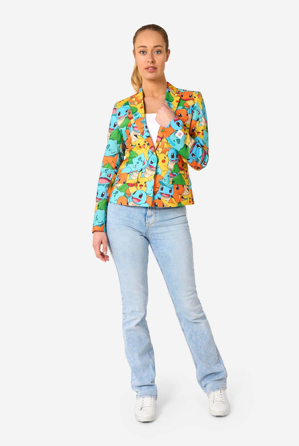 Woman wearing a colorful blazer with Pokemon character pattern on a white background