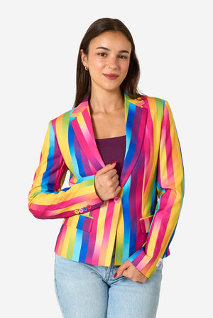 Woman wearing a colorful striped blazer against a white background