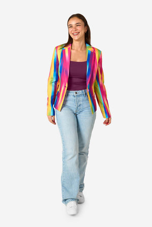 Woman wearing a colorful striped blazer and light blue jeans on a white background. Full body image