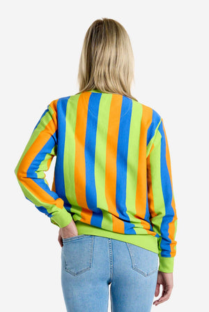Person wearing a colorful striped Bert sweater with a plain background. View from the back