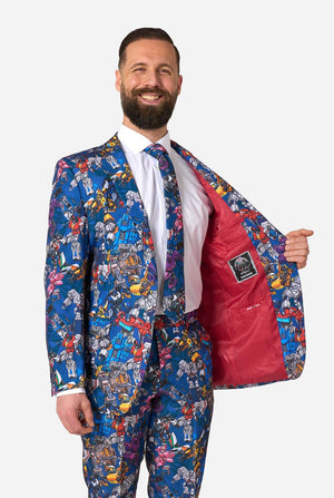 Man wearing a colorful Transformers suit with a patterned jacket and red lining, on a white background