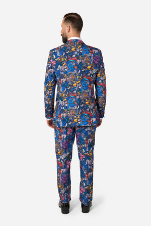 Man wearing a colorful Transformers suit with a white background. View from the back.