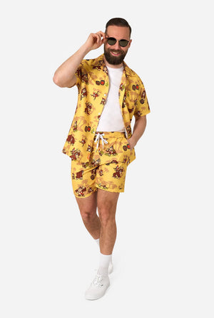 Man wearing a yellow Donkey Kong floral shirt and shorts set on a white background