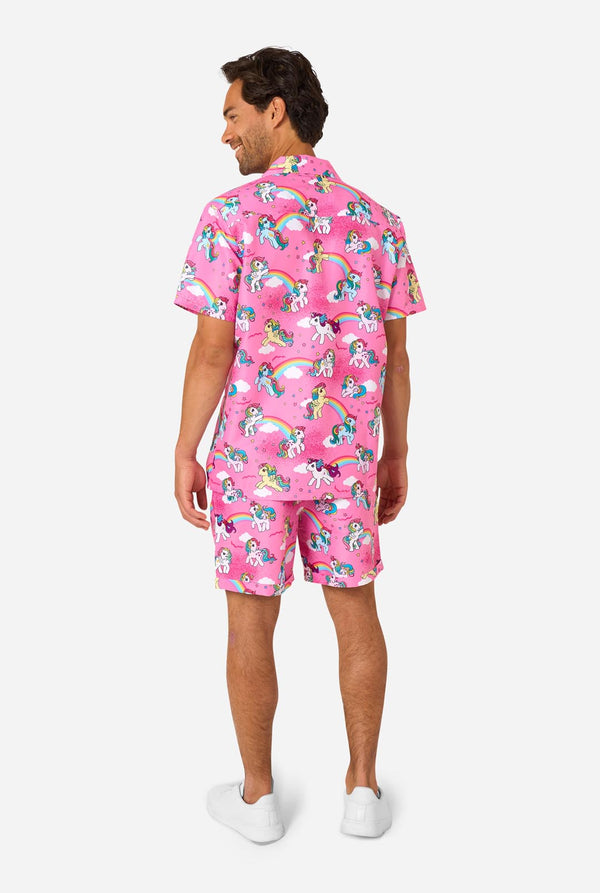 Man wearing a pink My Little Pony outfit with unicorn and rainbow patterns on a white background. View from the back.