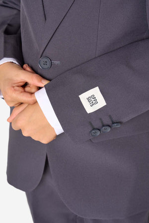 Close-up of a suit jacket with a brand label on a white background