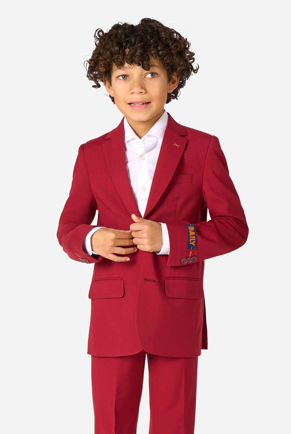 Child wearing a red suit with a white shirt on a white background