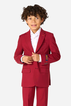 Child wearing a red suit with a white shirt on a white background