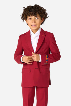 Child wearing a red suit with a white shirt on a white background