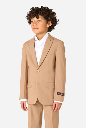Child wearing a beige suit with a white shirt on a light gray background