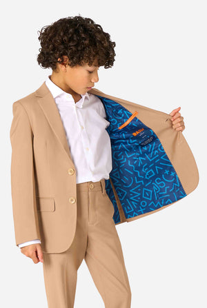 Child wearing a beige suit with a white shirt, showing the inside of his jacket.