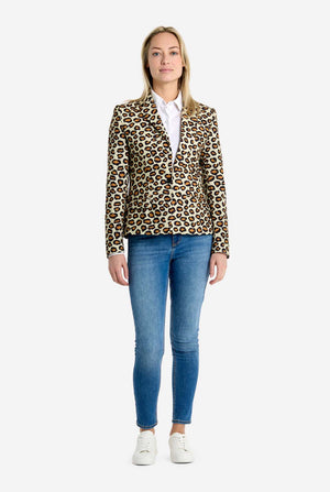 Woman wearing a leopard print blazer and blue jeans on a white background