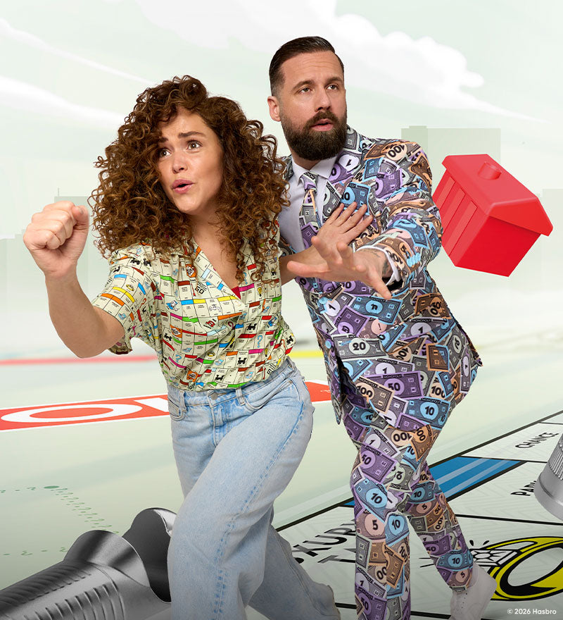 Image of a man and a woman running on a Monopoly board wearing Monopoly outfits.