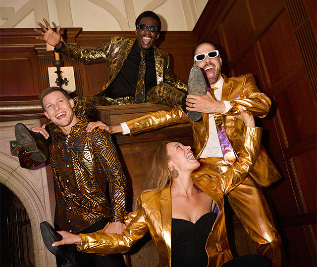 Couple partying wearing OppoSuits outfit