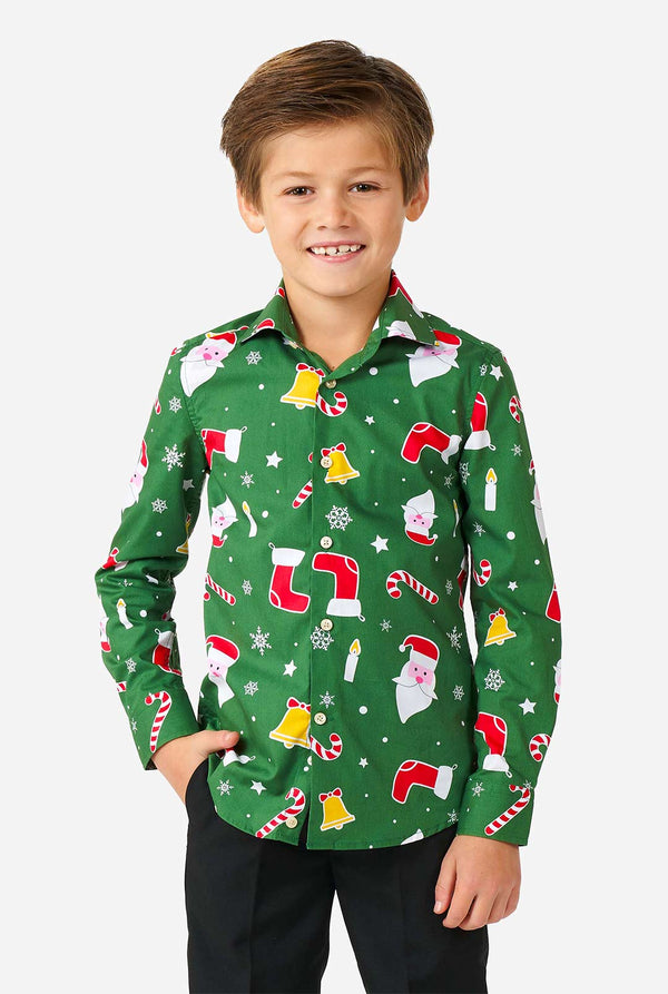 Kid wearing green Christmas shirt with Christmas icons