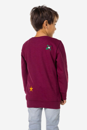 Back view of Kid wearing burgundy red Christmas sweater with colored Christmas icons