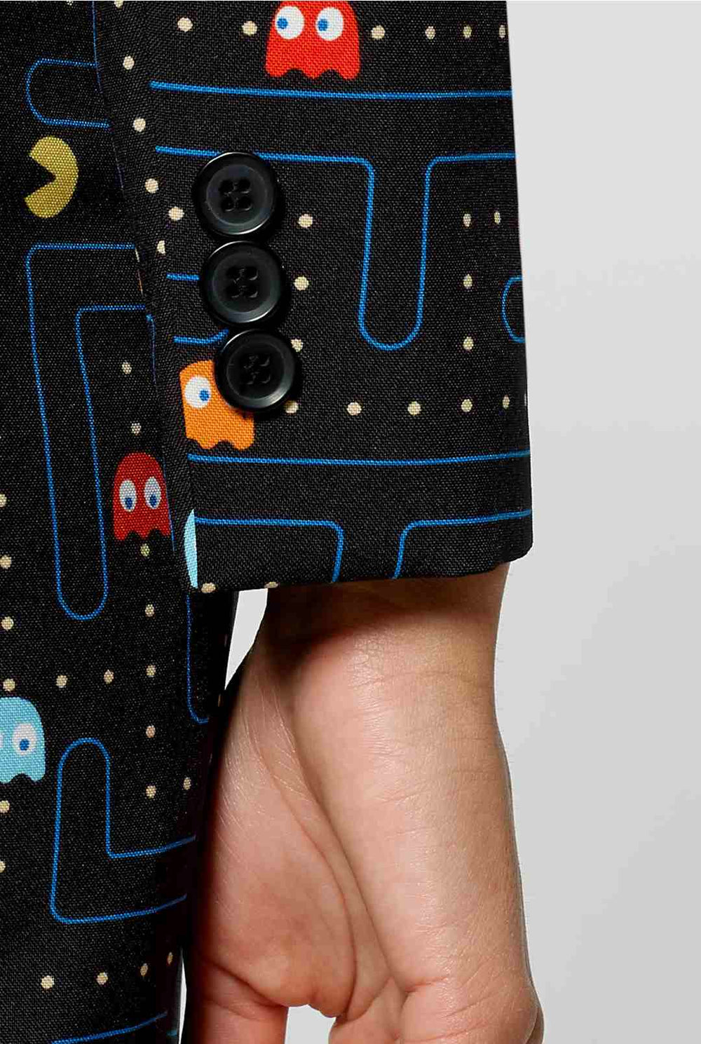 Woman wearing black blazer with Pac-Man print