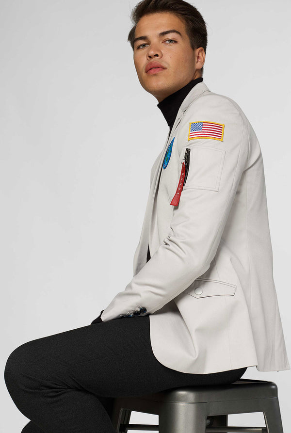 Light grey casual blazer with astronaut themed patches worn by man