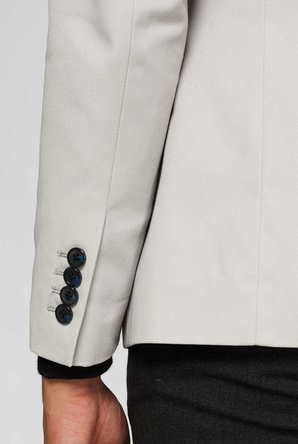 Light grey casual blazer with astronaut themed patches worn by man