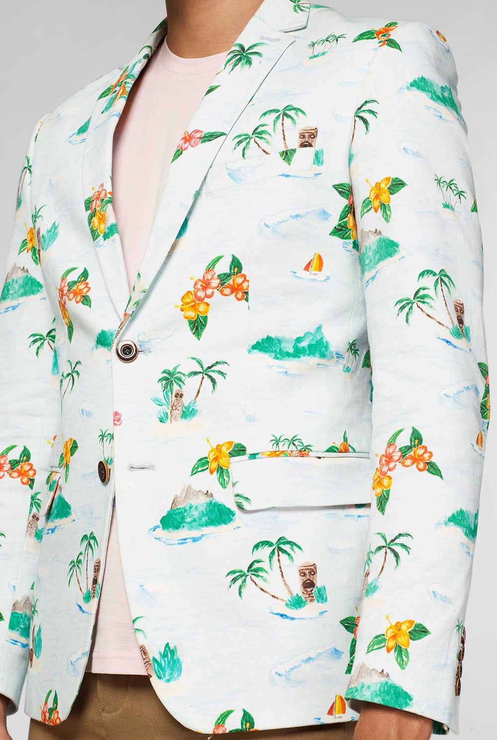 White casual blazer with Hawaiian icon print worn by man showing red palm tree inner lining