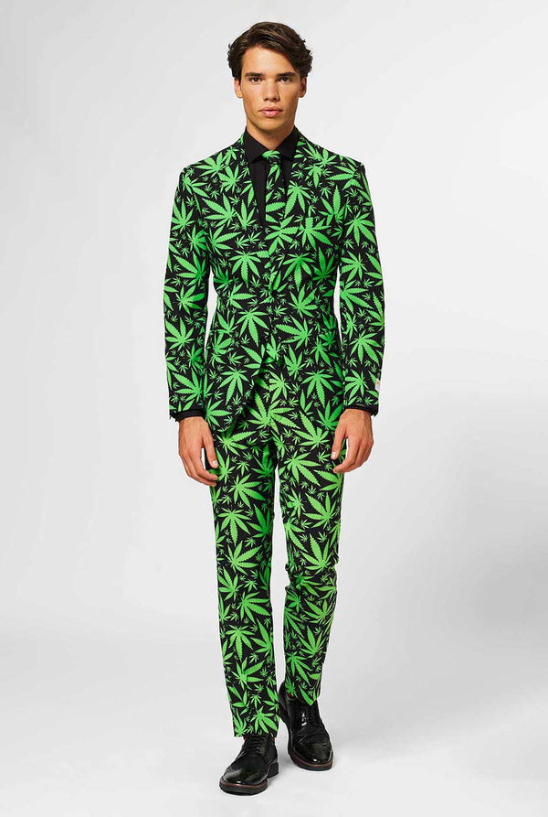 Man wearing black men's suit with green cannabis print