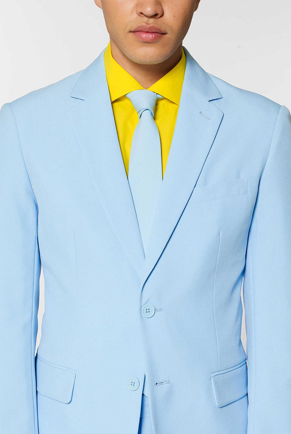 Man wearing light blue men's suit and yellow dress shirt