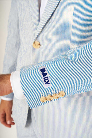 Man wearing stripped blue and white seer sucker suit