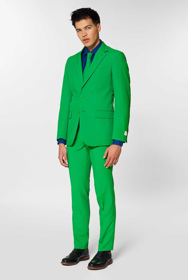 Man wearing green men's suit and dark blue dress shirt