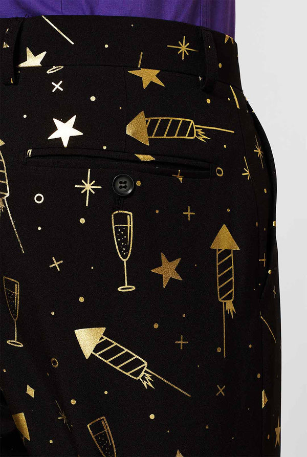 Black men's suit with golden fireworks print worn by man