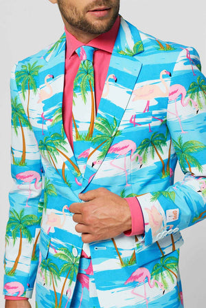 Blue and white men's suit with tropical flamingo print Flaminguy worn by man close up