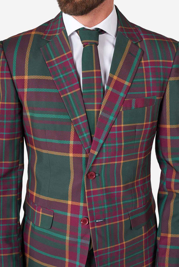 Man wearing a tartan plaid Christmas suit
