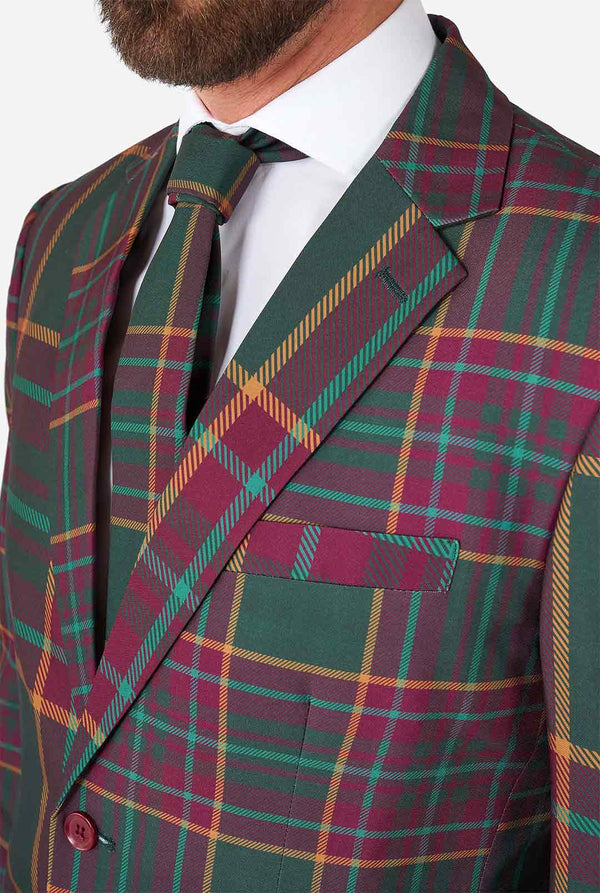 Man wearing a tartan plaid Christmas suit