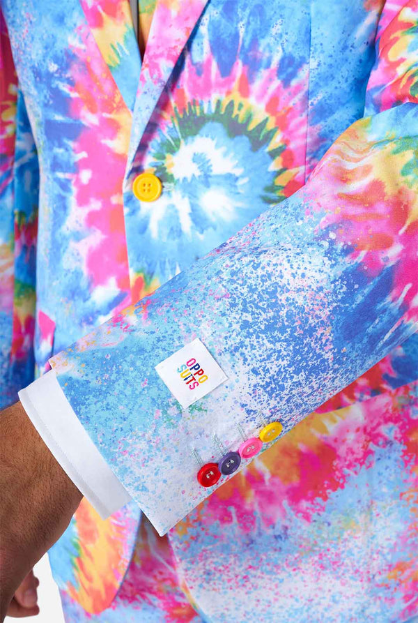 Man wearing pride men's suit with colorful tie dye rainbow print 