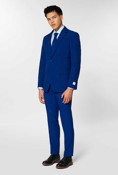 Navy blue men's suit worn by man