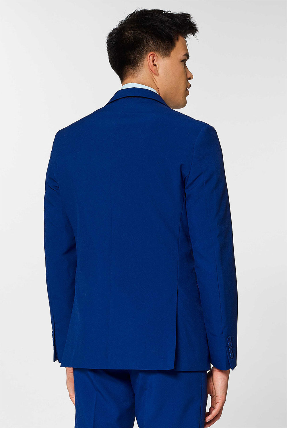 Video of man wearing Navy Royale, dark blue men's suit, showing suit like a model. Suit consists of blazer, pant and tie.