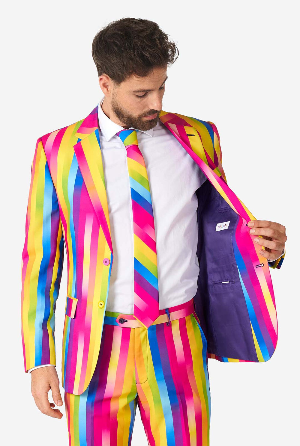 Video of man wearing Rainbow Glaze, rainbow colored men's suit, showing suit like a model. Suit consists of blazer, pant and tie.