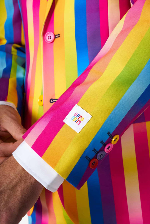 Man wearing rainbow-colored suit