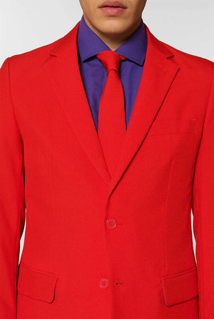 Man wearing red men's suit with purple dress shirt 
