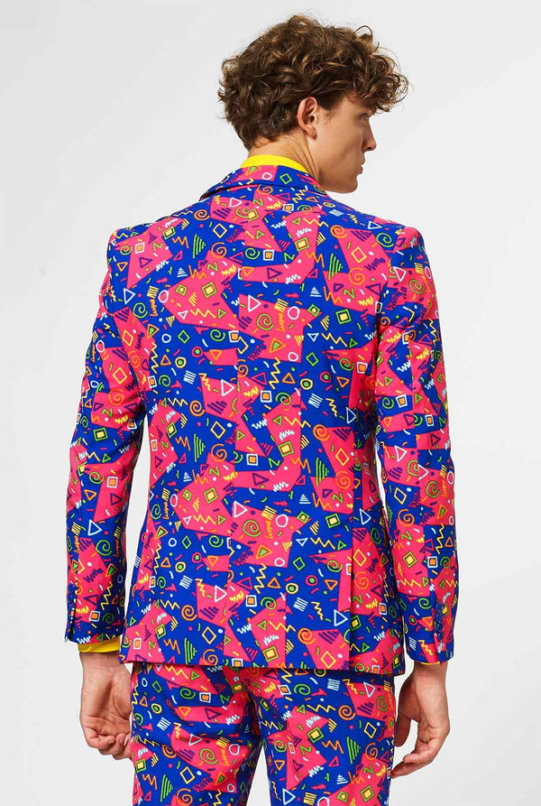 Funky pink and blue men's suit with abstract icons worn by man