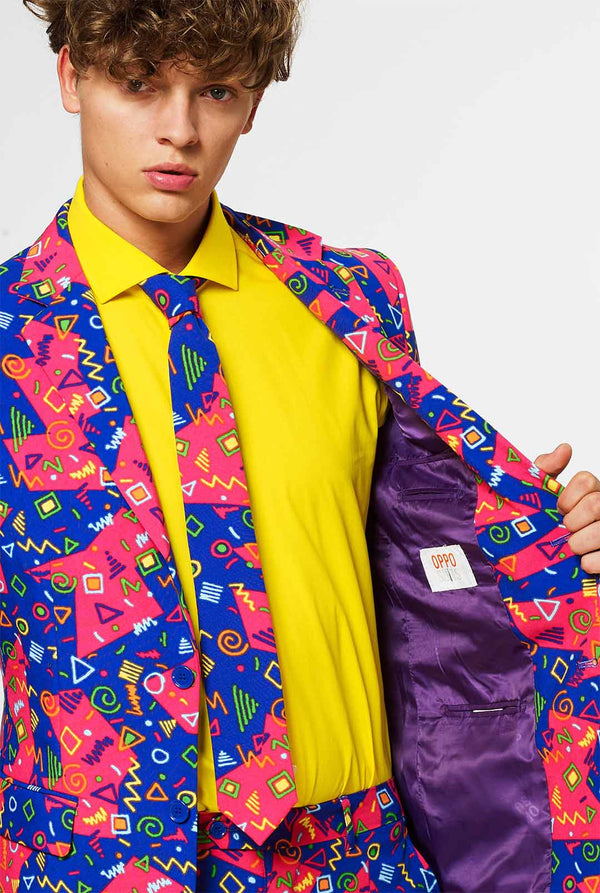 Funky pink and blue men's suit with abstract icons worn by man