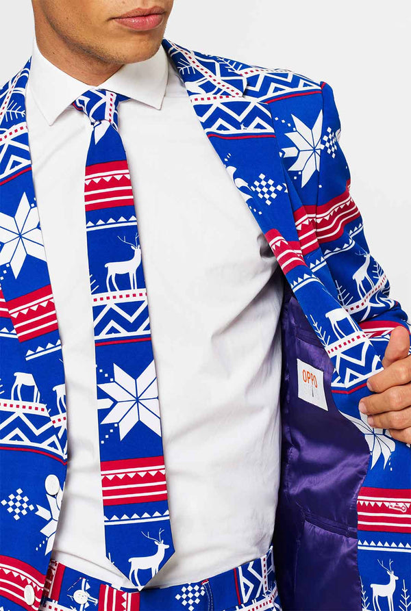 Man wearing blue Christmas suit with Nordic themed print