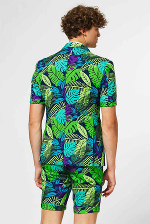 Man wearing green summer suit with jungle leaf print