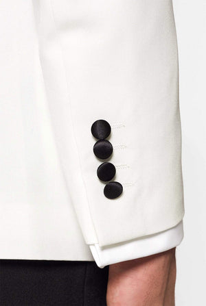 White with black tuxedo suit Pearly White worn by man closed up blazer